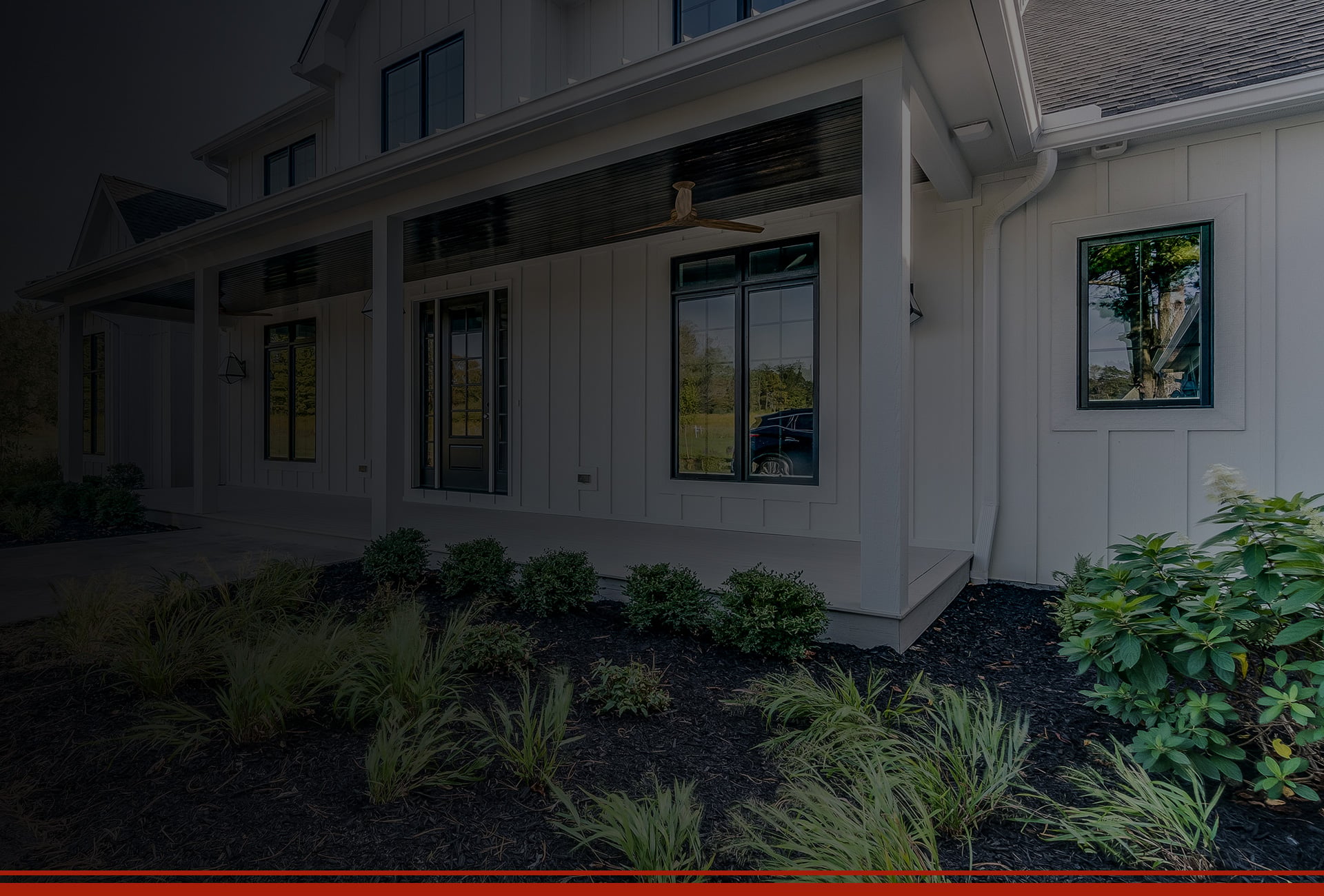 A house featuring a red banner that reads "home improvement services" with the logo of JDI Windows displayed prominently.